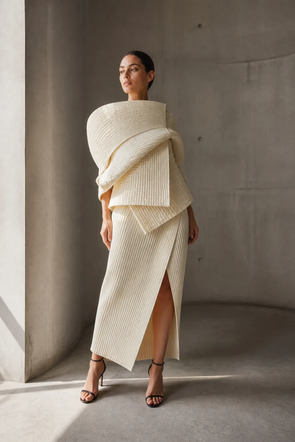 Ivory pleated fashion look photographed in curved concrete generated by Grok Imagine Image 2.0